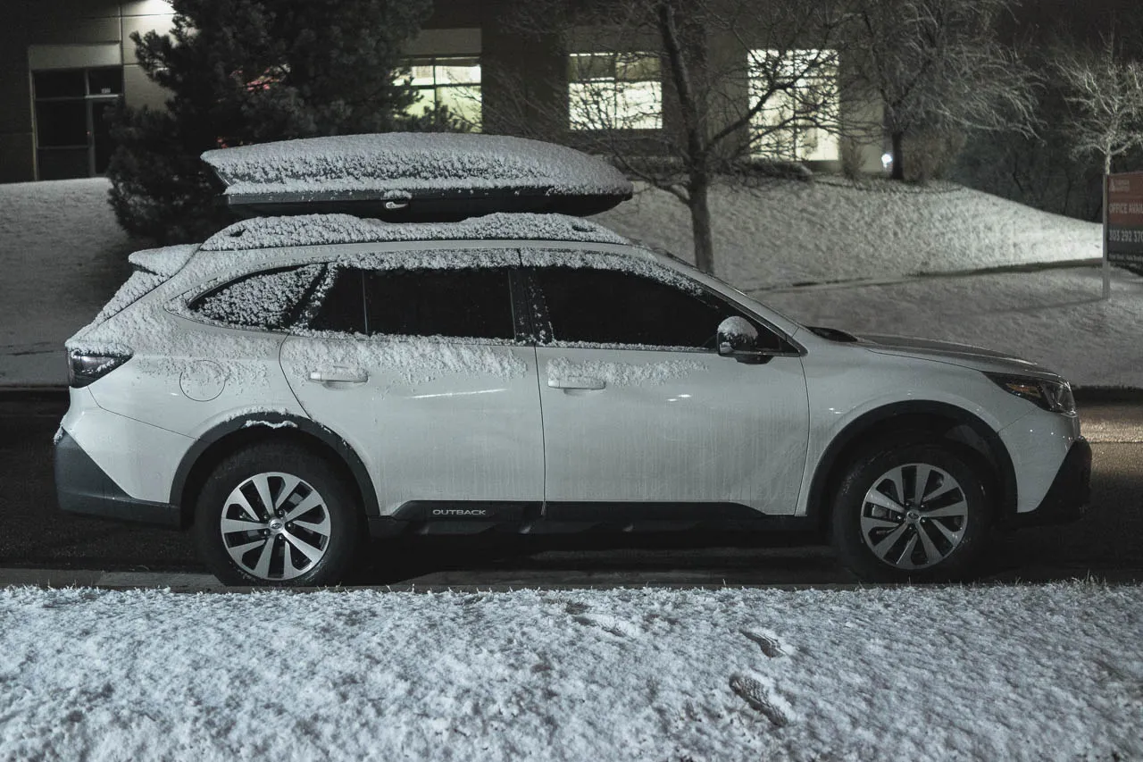 Subaru Outback Vanlife with OEM window deflectors in snow